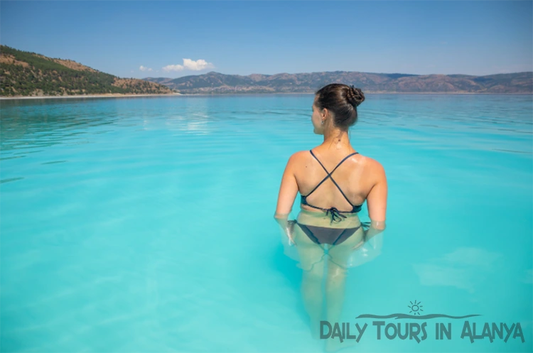 Woman swimming in Salda lake